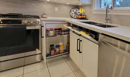 Compact Kitchen with Textured Backsplash - Image 5