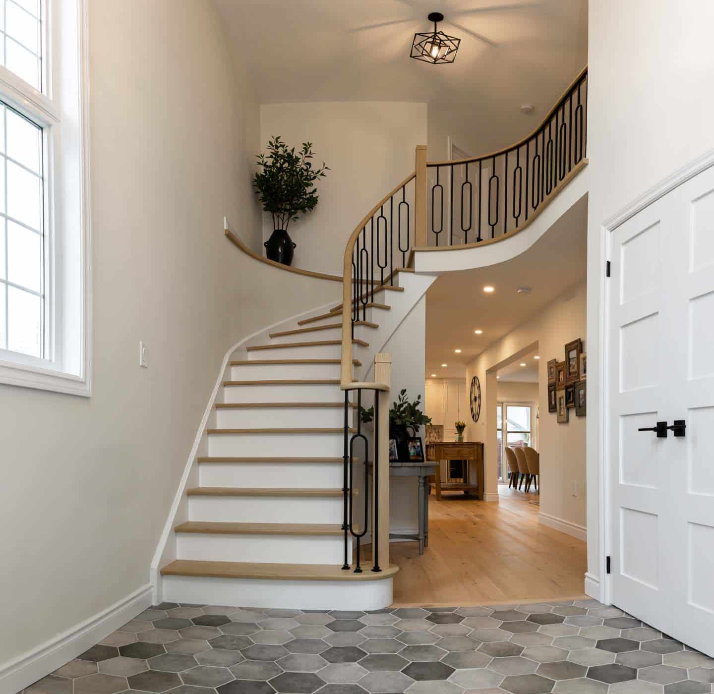 Stained stair treads and railing with black metal pickets