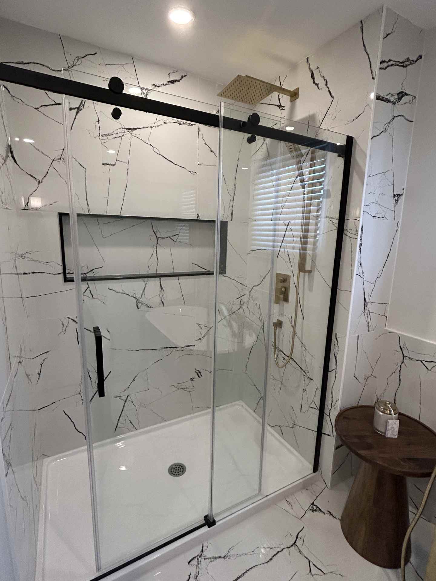 Monochromatic bathroom renovation in Ajax with walk-in shower